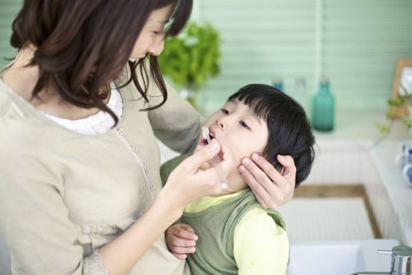 Japanese Mother and Son Brushing Teeth