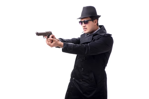 Man spy with handgun isolated on white background