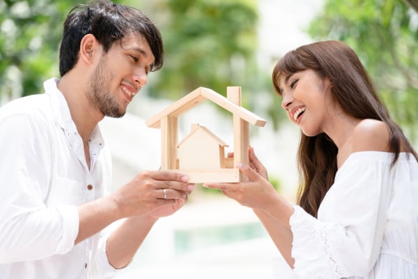 Young couple planning to buy a house concept.