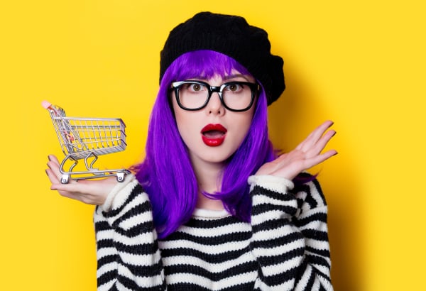 woman with purple hair and shopping cart